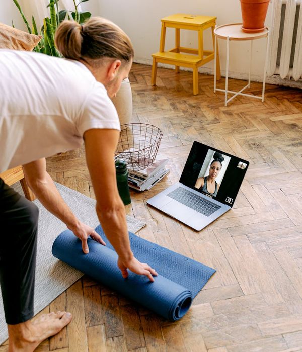 A person smiling and looking relaxed after a yoga session.