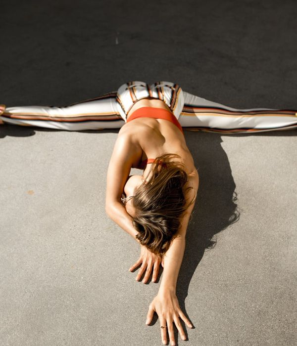 Person stretching gracefully, showing flexibility and calm focus.